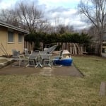 Very old and broken concrete patio and fence