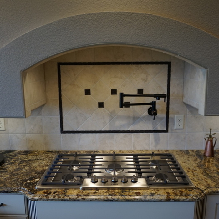 beautiful full tile back splash behind burner