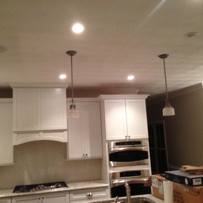 Construction of a Transitional kitchen with Bright White Cabinetry