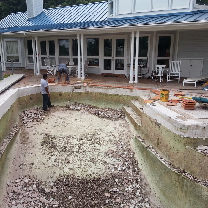 Pool empty and new coping going in.