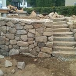 finishing touches on stone wall