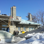Guys working on back of home