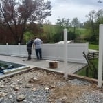 Pool deck, vinyl fence.