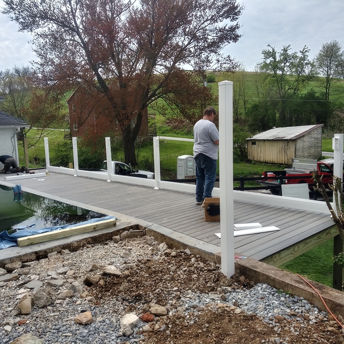 Pool deck, vinyl fence.