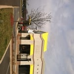 Exterior painting of awnings,roof and mullions.