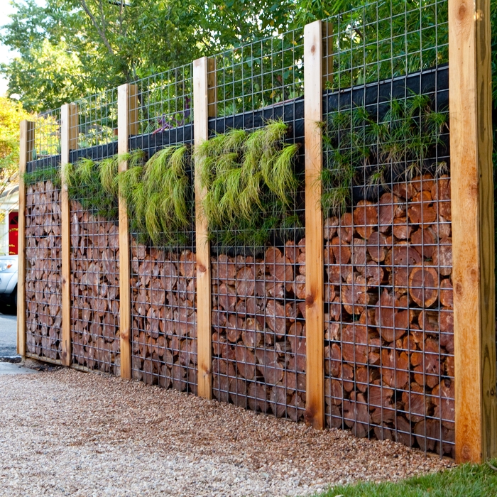 custom fence with cedar pucks and sedums