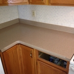 piece to the left of the stove