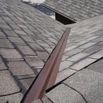 a close up of the open metal w-style valley