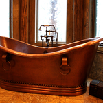 an impressive copper free standing tub with an oil rubbed bronze faucet