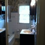 Tile floor, Vanity, Light and Mirror