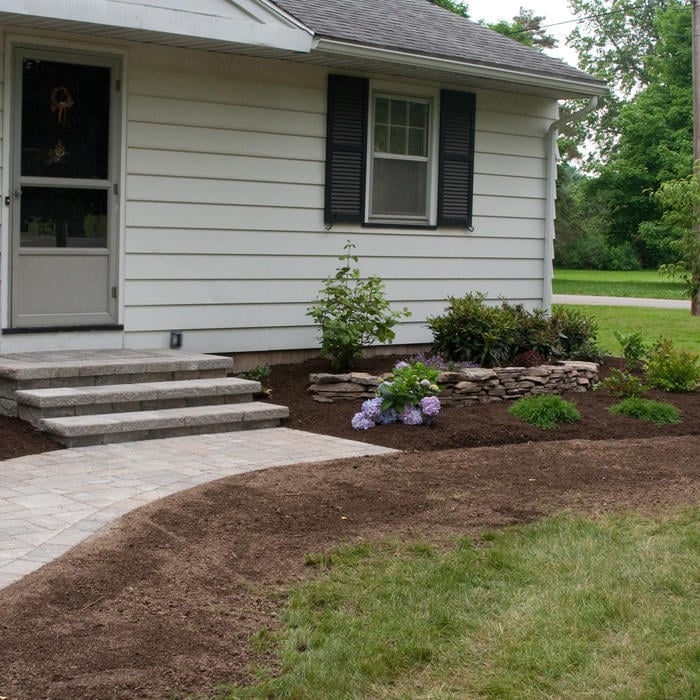 modest home with new landscaping