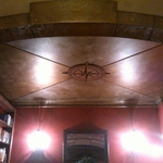Faux stone archway, antiqued copper and puter.