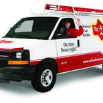 Technician in van waving