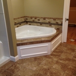 Corner tub with picture frame molding surround