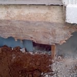 Rotting wall behind old stoop