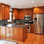 Oak kitchen with flat paneled doors.