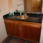 Custom Cherry vanity, granite tile/slate floor