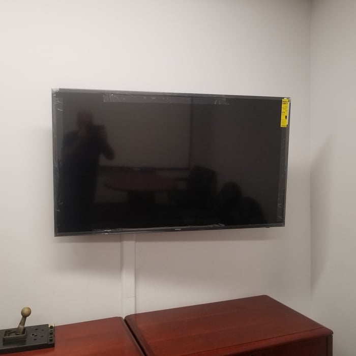 55" inch TV installed into cubical