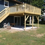 exterior raised deck with concrete patio below
