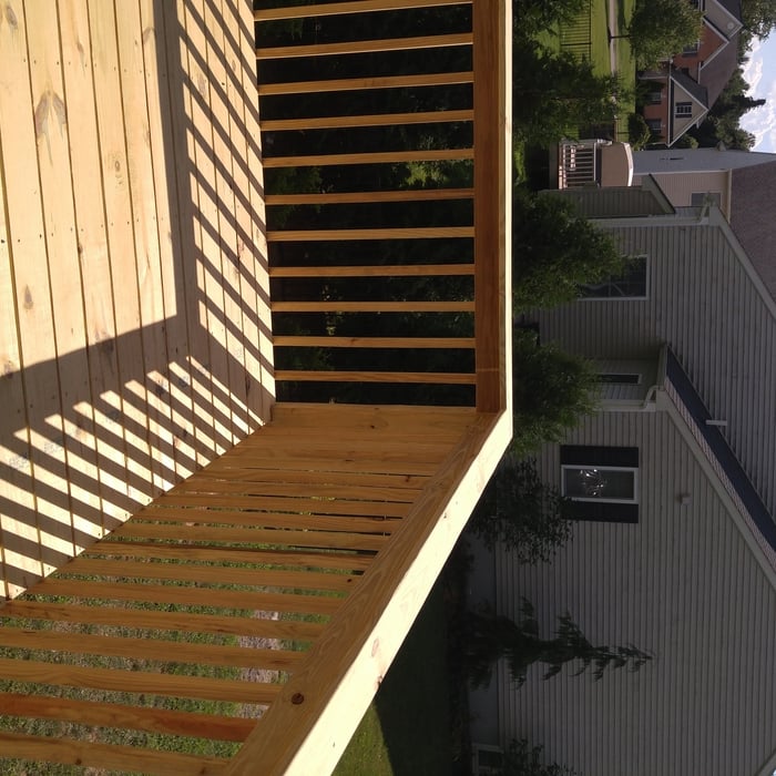exterior raised deck with concrete patio below
