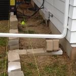 Old retaining wall with existing window barriers