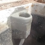 cement baffle outgoing inside septic tank