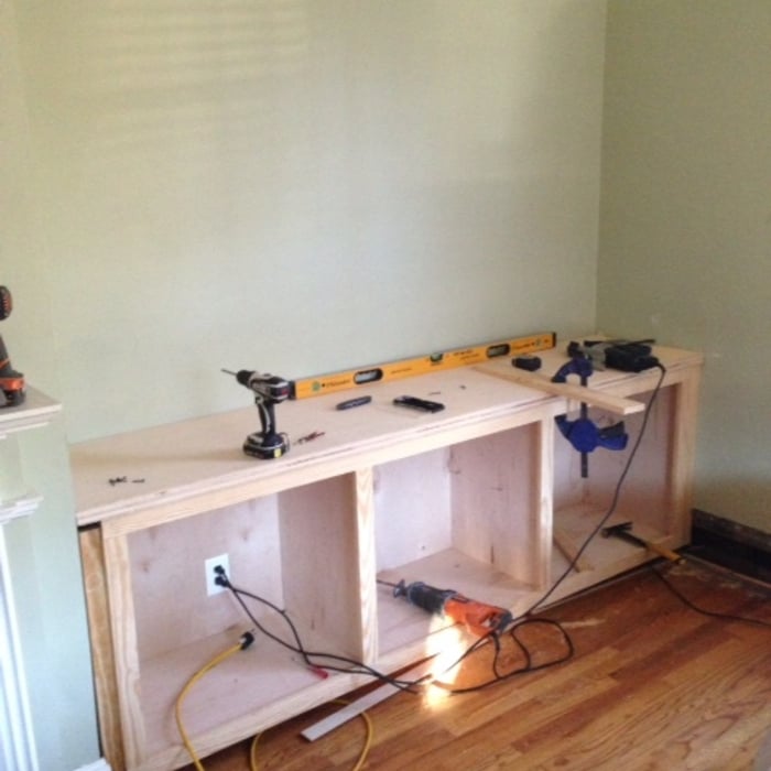 Cabinets in with electrical box cut in and top on