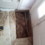 water damage from the door on the floor