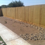 Gravel landscape border around fence