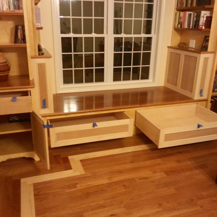 Custom shelving, wine bar, & window bench