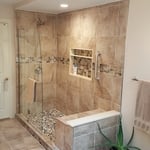 Large Partial Walk In Shower with Warm Brown Tile Selections and a Shower Bench