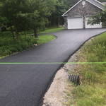 New driveway graded, compacted, and paved