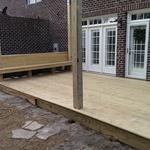New deck with bench and pergola.