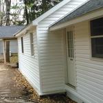 cozy white house with vinyl siding