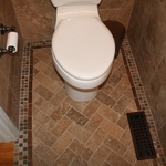 Herring bone pattern with travertine subway tiles