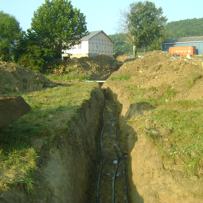 Bedding pipes with sand.
