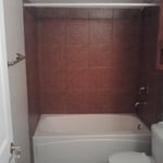 Remodled bathroom including bath and tile