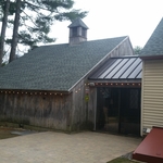 Asphalt roof with metal roof accent