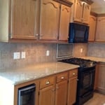side view of granite, backsplash cabinet install