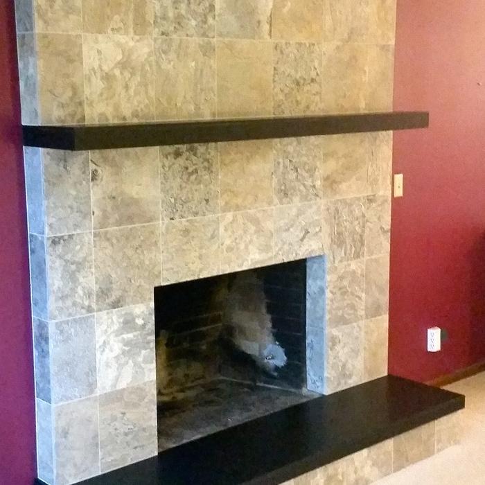 travertine fireplace with granite mantle & hea