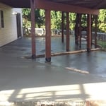finished concrete under existing deck