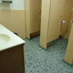 Before pic of women's bathroom stalls