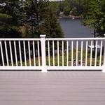 Deck with railing overlooking water