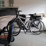 Bikes and paddleboards on the floor and in the wat