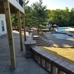Finished Patio and Pool with Customer looking on