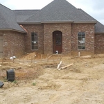 concrete sidewalk and driveway.