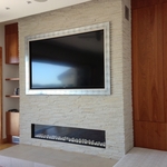 90" tv behind moving art