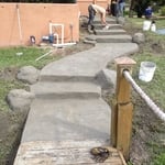 Soon-to-be careved stamped sidewalk with boulders