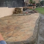 Patio, retaining wall, and waterfall