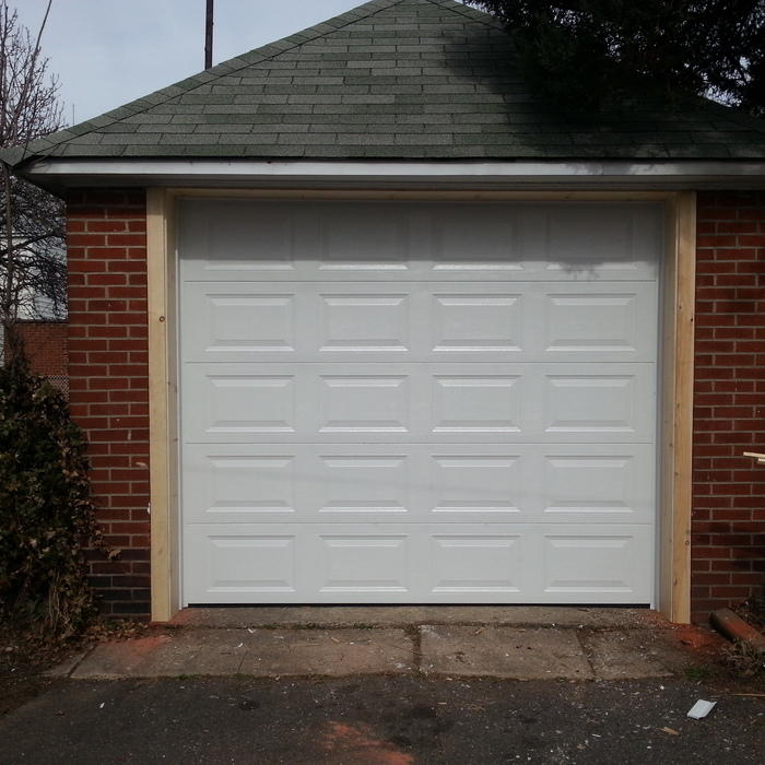 New garage door installed with frame work